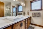 Master bathroom with double vanity and walk-in shower